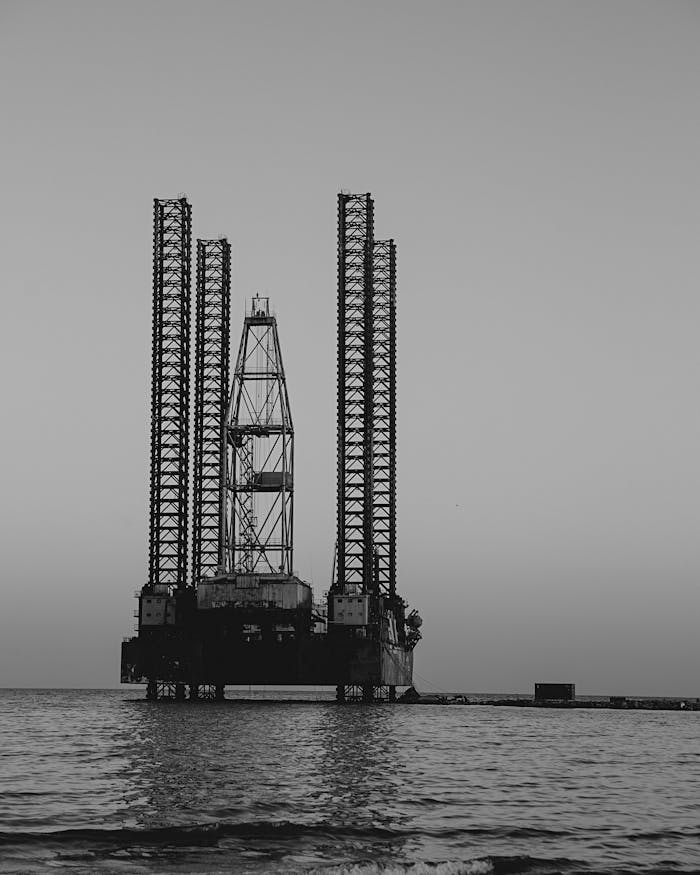 Black and white image of a towering oil rig in the Caspian Sea, Baku.